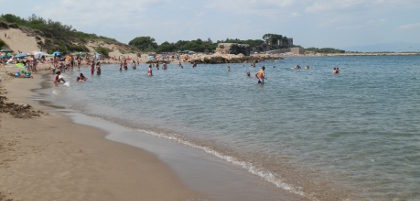 Beach by the ancient greek port wall of Empuries