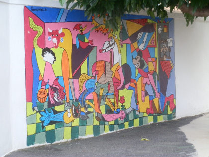 Cerberes version of Guernika on a school wall